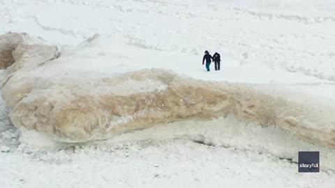 Two Daredevils Spotted Walking on Ice Shelf